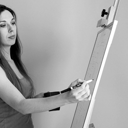 Amanda drawing on a whiteboard as part of her creative process.